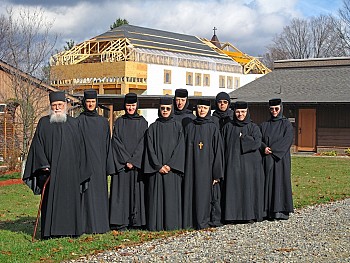 Fr Roman Braga, Mother Abbess Gabriela, and the Sisterhood, with the new church in the background.